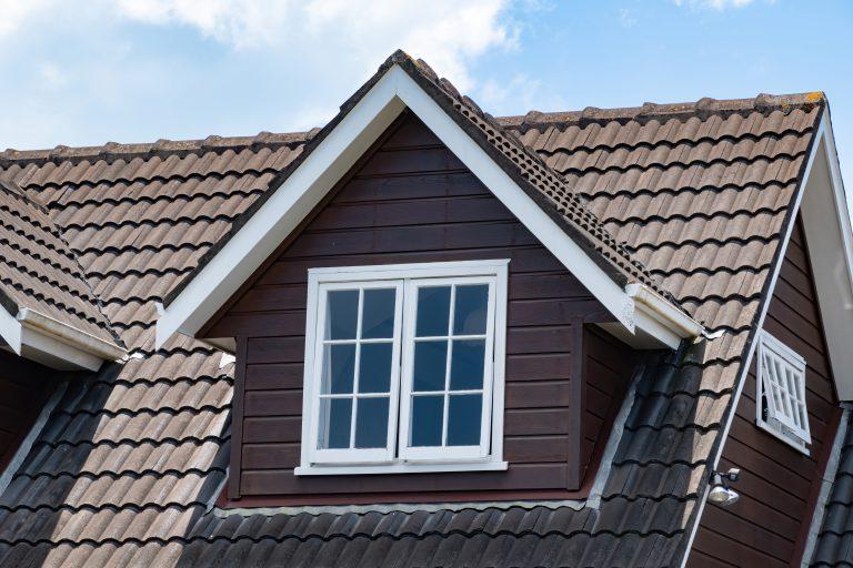 View,Of,Brown,Pitched,Roof,Dormer,Loft,With,White,Window
